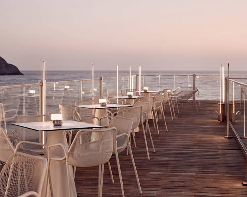 Evening shot of the tables and chairs on the marina