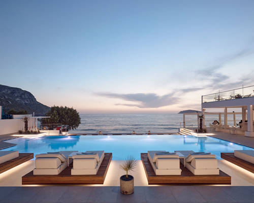 Evening photo of the pool with the lights on