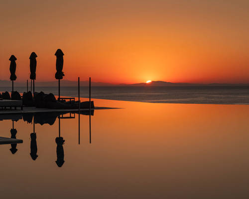 Sunset side view of the pool