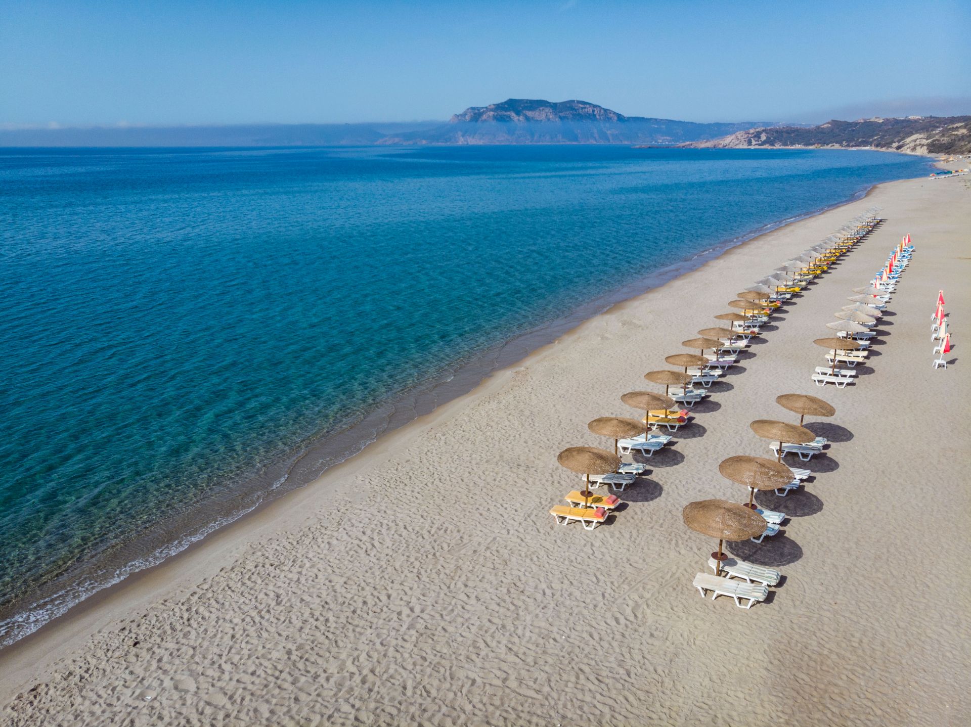 
View of the beach with sunbeds and umbrellas from above