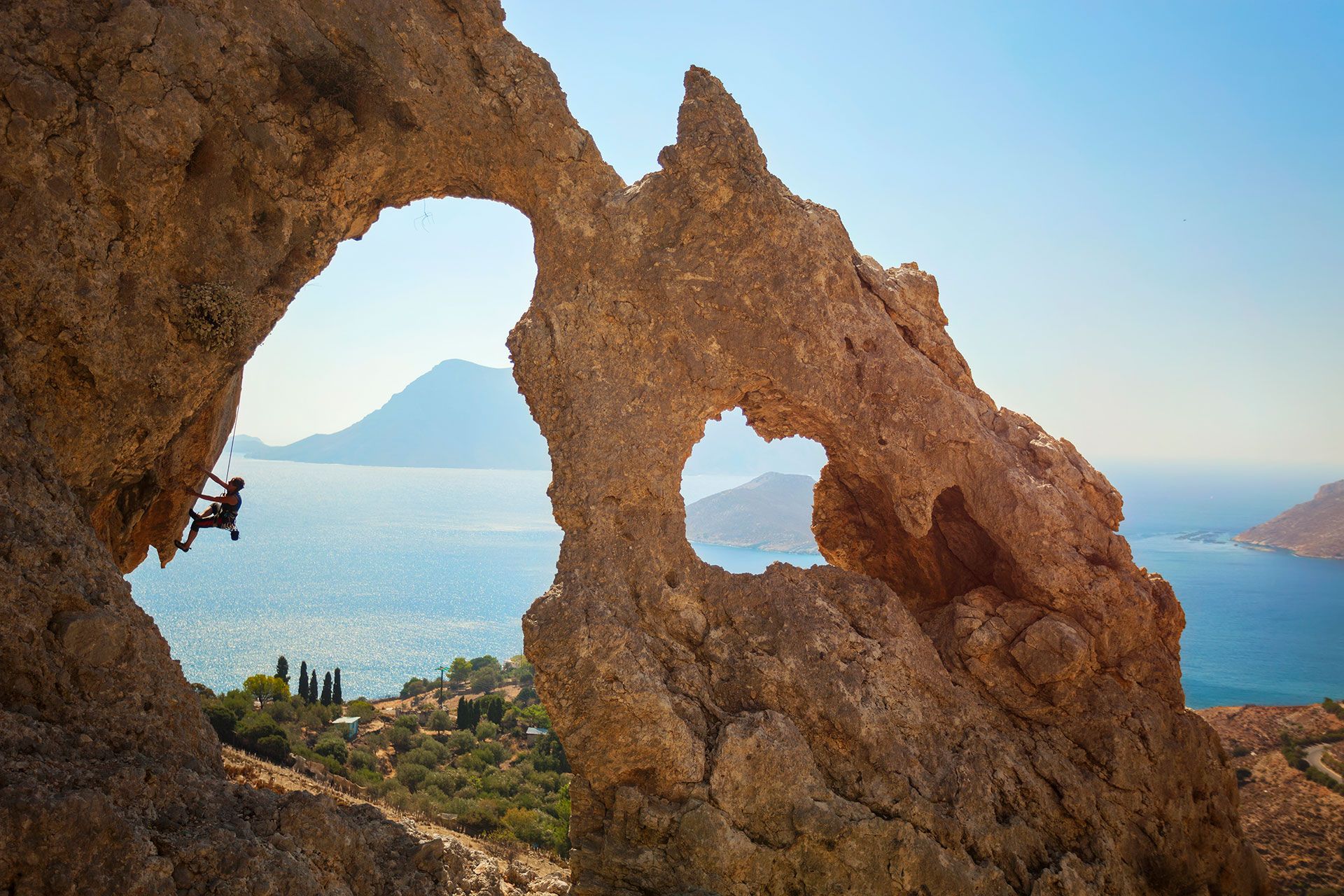 
Rock climber with the sea as background