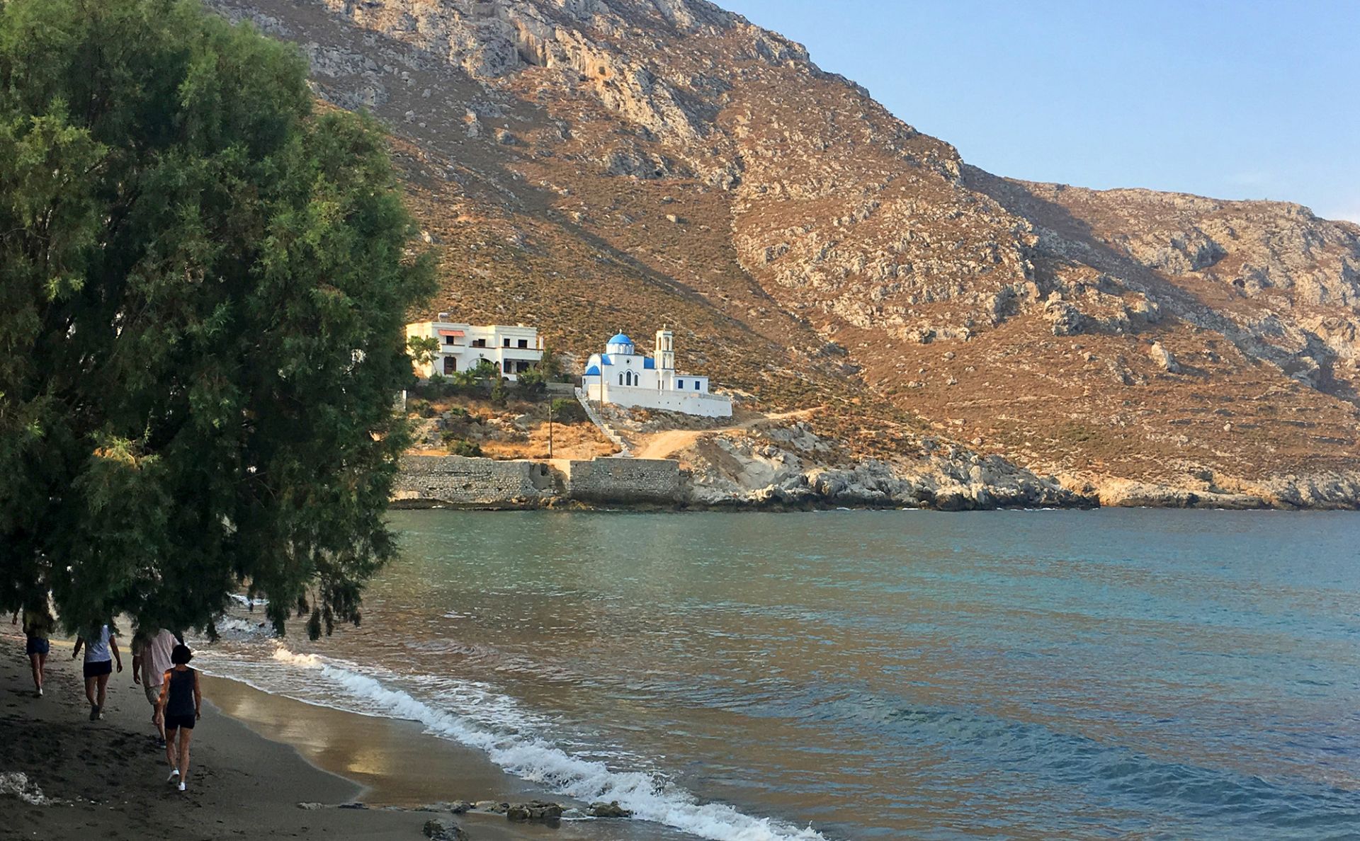 
Beach side view of a mountain with a church