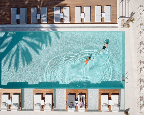 Top-down view of the pool and sunbeds